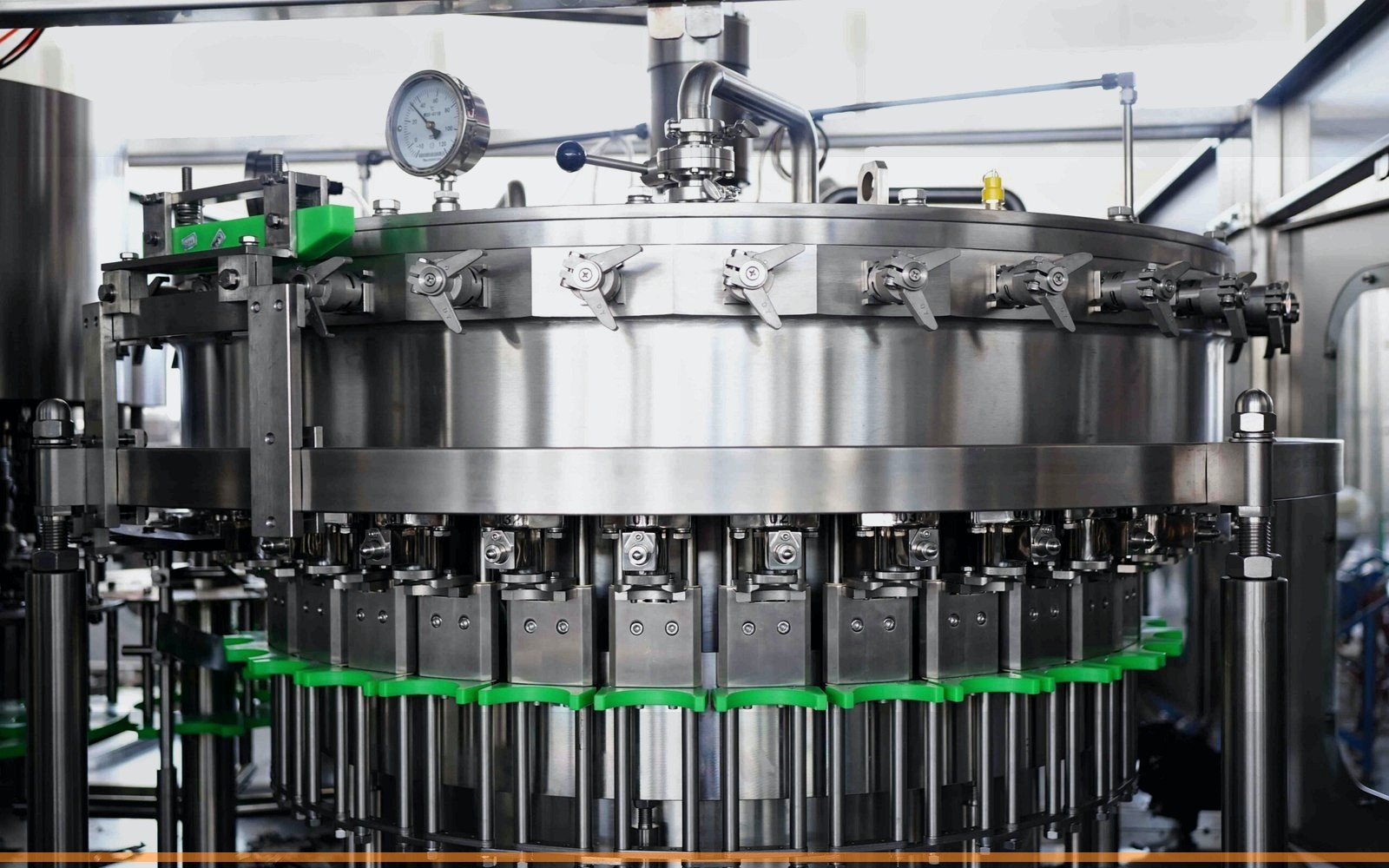 Close-up stainless steel beverage filling equipment